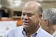 FILE - Int his May 10, 2016, file photo, billionaire hedge fund manager David Tepper mingles during a grand opening of rock star and philanthropist Jon Bon Jovi's Jon Bon Jovi Soul Foundation Soul Kitchen and B.E.A.T. Center, which stands for Bringing Everyone All Together, in Toms River, N.J. People familiar with the situation say Tepper has agreed to buy the Carolina Panthers from team founder Jerry Richardson for a record $2.2 billion. The people spoke to The Associated Press on Tuesday, May 15, 2018, on condition of anonymity because the team has not yet announced the sale. The purchase is subject to a vote at the NFL owners meeting next week in Atlanta. (AP Photo/Mel Evans, File)