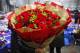 A woman holds a bouquet of Valentine's Day roses at the flower market in Beijing, Tuesday, Feb. 14, 2017. Valentine's Day is not a tradition in China but is becoming increasingly popular as Chinese adopt Western customs, encouraged by retailers who see them as a way of boosting sales. (AP Photo/Andy Wong)