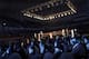The faces of North Koreans are illuminated by stage lighting as they watch pro wrestlers enter the arena, Saturday, Aug. 30, 2014 in Pyongyang, North Korea. North Koreans got their first look at pro wrestling in about 20-years on Saturday when former NFL lineman Bob
