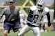 Dallas Cowboys offensive coordinator Jason Garrett, left, and wide receiver Terrell Owens (81) during NFL football training camp, Tuesday, July 29, 2008, in Oxnard, Calif. (AP Photo/Tony Gutierrez)