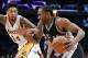 San Antonio Spurs' Kawhi Leonard, right, drives past Los Angeles Lakers' Brandon Ingram during the second half of an NBA basketball game, Sunday, Feb. 26, 2017, in Los Angeles. (AP Photo/Jae C. Hong)