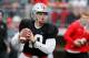 FILE - In this April 14, 2018, file photo, Ohio State quarterback Joe Burrow drops back to pass during an NCAA college spring football game in Columbus, Ohio. Facing the possibility of sitting as a backup for a third season at Ohio State, quarterback Joe Burrow announced on Tuesday, May 8, 2018, his intention to transfer. The news from the redshirt junior, delivered via Twitter, wasn’t unexpected. (AP Photo/Jay LaPrete, File)
