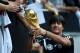 Germany's head coach Joachim Loew shows the world cup trophy during a public training session of the German national football team in Duesseldorf, Germany on September 1, 2014. Germany's squad prepares for the upcoming friendly game against Argentina on September 3, 2014 in Duesseldorf. AFP PHOTO / PATRIK STOLLARZ (Photo credit should read PATRIK STOLLARZ/AFP/Getty Images)