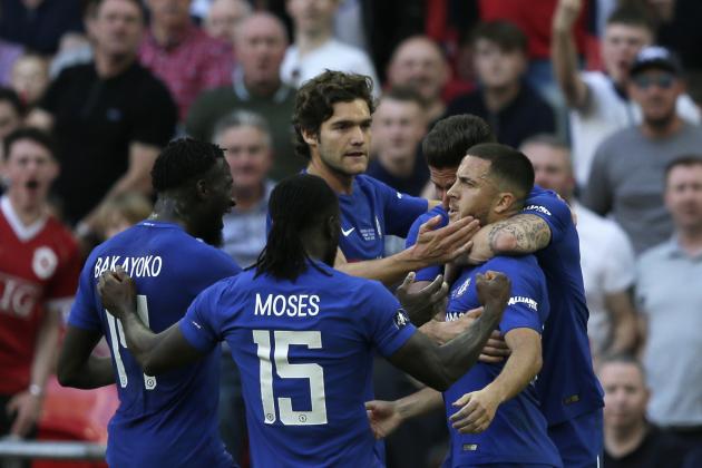 Chelsea's Eden Hazard, right, celebrates after scoring the opening goal during the English FA Cup final soccer match between Chelsea and Manchester United at Wembley stadium in London, Saturday, May 19, 2018. (AP Photo/Tim Ireland)