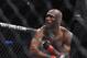Welterweight Kamaru Usman follows through on punch to Sean Strickland during a mixed martial arts bout at UFC 210, Saturday, April 8, 2017, in Buffalo, N.Y. (AP Photo/Jeffrey T. Barnes)