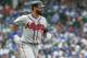 Atlanta Braves' Jose Bautista watches his three-run home run off Chicago Cubs' Jose Quintana during the fifth inning of a baseball game, Monday, May 14, 2018, in Chicago. Braves' Nick Markakis and Tyler Flowers scored on the play. (AP Photo/Kamil Krzaczynski)