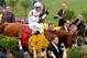 BALTIMORE, MD - MAY 19: Jockey Mike Smith and racing horse Justify enter the winners circle at the 143rd Preakness Stakes on May 19, 2018 in Baltimore, Maryland. (Photo by Paul Morigi/Getty Images for The Stronach Group)