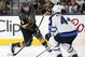 Vegas Golden Knights defenseman Colin Miller, left, shoots past Winnipeg Jets defenseman Josh Morrissey during the second period of Game 4 of the NHL hockey Western Conference finals Friday, May 18, 2018, in Las Vegas. (AP Photo/John Locher)