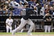 FILE - In this May 10, 2018, file photo, Atlanta Braves' Jose Bautista bats during the fourth inning of a baseball game against the Miami Marlins in Miami. The Braves have released Bautista a month after picking up the veteran slugger and will make Johan Camargo their starting third baseman. (AP Photo/Wilfredo Lee, File)