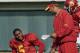 Southern California tail back Reggie Bush, left, listens to running backs coach Todd McNair, center, as LenDale White looks on during a work-out in Los Angeles Thursday, Dec. 29, 2005. The Trojans face the University of Texas in the national championship game at the Rose Bowl on Wednesday, Jan. 4, 2006. (AP Photo/Kevork Djansezian)