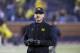 Michigan head coach Jim Harbaugh on the field during warmups before an NCAA college football game against Minnesota in Ann Arbor, Mich., Saturday, Nov. 4, 2017. (AP Photo/Tony Ding)