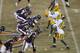 The Chicago Bears and Green Bay Packers square of at the line of scrimmage during the first half of an NFL football game, Sunday, Dec. 29, 2013, in Chicago. (AP Photo/Kiichiro Sato)