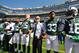 EAST RUTHERFORD, NJ - SEPTEMBER 24: Jermaine Kearse #10 and Josh McCown #15, Jamal Adams #33 and Christopher Johnson CEO of the New York Jets stand in unison with their team during the National Anthem prior to an NFL game against the Miami Dolphins at MetLife Stadium on September 24, 2017 in East Rutherford, New Jersey. (Photo by Al Bello/Getty Images)