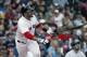 Boston Red Sox's J.D. Martinez watches his two-run home run during the fifth inning of a baseball game against the Baltimore Orioles in Boston, Sunday, May 20, 2018. (AP Photo/Michael Dwyer)