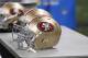 San Francisco 49ers helmets are seen in the bench area during the second half of an NFL football game against the Detroit Lions, Sunday, Dec. 27, 2015, in Detroit. (AP Photo/Duane Burleson)