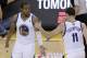 Golden State Warriors small forward Andre Iguodala (9) is congratulated by shooting guard Klay Thompson (11) after making a three point basket against the Los Angeles Clippers during the fourth quarter of Game 6 of an opening-round NBA basketball playoff series in Oakland, Calif., Thursday, May 1, 2014. The Warriors won 100-99. (AP Photo/Jeff Chiu)