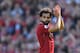 Liverpool's Egyptian midfielder Mohamed Salah applauds fans as he is substituted during the English Premier League football match between Liverpool and Brighton and Hove Albion at Anfield in Liverpool, north west England on May 13, 2018. (Photo by Paul ELLIS / AFP) / RESTRICTED TO EDITORIAL USE. No use with unauthorized audio, video, data, fixture lists, club/league logos or 'live' services. Online in-match use limited to 75 images, no video emulation. No use in betting, games or single club/league/player publications. / (Photo credit should read PAUL ELLIS/AFP/Getty Images)