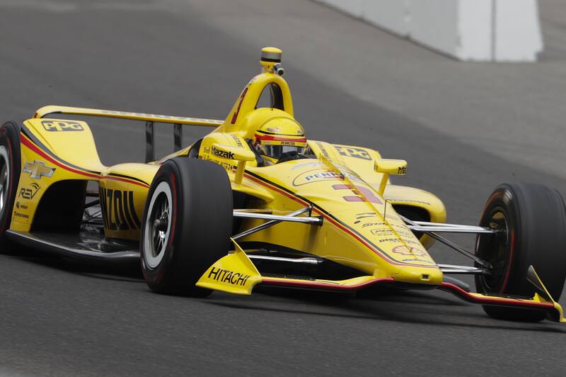 Helio Castroneves, of Brazil, heads into the first turn during a practice session for the IndyCar Indianapolis 500 auto race at Indianapolis Motor Speedway, in Indianapolis Monday, May 21, 2018. (AP Photo/Michael Conroy)
