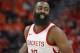 Houston Rockets guard James Harden smiles as he runs up the court after scoring a 3-pointer against the Utah Jazz during the second half in Game 3 of an NBA basketball second-round playoff series Friday, May 4, 2018, in Salt Lake City. The Rockets won 113-92. (AP Photo/Rick Bowmer)