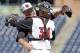 Louisville pitcher Austin Conway hugs catcher Zach Britton (34) following an Atlantic Coast Conference NCAA college baseball tournament semifinal game against Pittsburgh in Durham, N.C., Saturday, May 26, 2018. Louisville won 5-2 to advance to the final. (AP Photo/Gerry Broome)