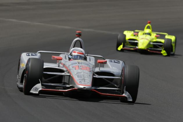Will Power, of Australia, leads Simon Pagenaud, of France, though the first turn during the Indianapolis 500 auto race at Indianapolis Motor Speedway, in Indianapolis Sunday, May 27, 2018. (AP Photo/AJ Mast)