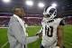Arizona Cardinals running back Adrian Peterson, left, greets Los Angeles Rams running back Todd Gurley an NFL football game, Sunday, Dec. 3, 2017, in Glendale, Ariz. The Rams won 32-16. (AP Photo/Rick Scuteri)