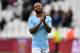 Manchester City's English midfielder Raheem Sterling applauds supporters on the pitch after the English Premier League football match between West Ham United and Manchester City at The London Stadium, in east London on April 29, 2018. - Manchester City won the game 4-1. (Photo by Ben STANSALL / AFP) / RESTRICTED TO EDITORIAL USE. No use with unauthorized audio, video, data, fixture lists, club/league logos or 'live' services. Online in-match use limited to 75 images, no video emulation. No use in betting, games or single club/league/player publications. / (Photo credit should read BEN STANSALL/AFP/Getty Images)