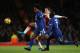 LONDON, ENGLAND - JANUARY 03: Hector Bellerin of Arsenal competes with Willian and N'Golo Kante of Chelsea during the Premier League match between Arsenal and Chelsea at Emirates Stadium on January 3, 2018 in London, England. (Photo by Matthew Ashton - AMA/Getty Images)