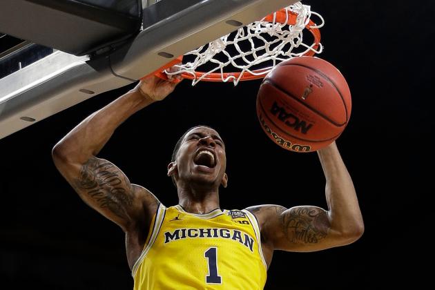 Michigan's Charles Matthews (1) dunks during the second half in the semifinals of the Final Four NCAA college basketball tournament against Loyola-Chicago, Saturday, March 31, 2018, in San Antonio. (AP Photo/David J. Phillip)