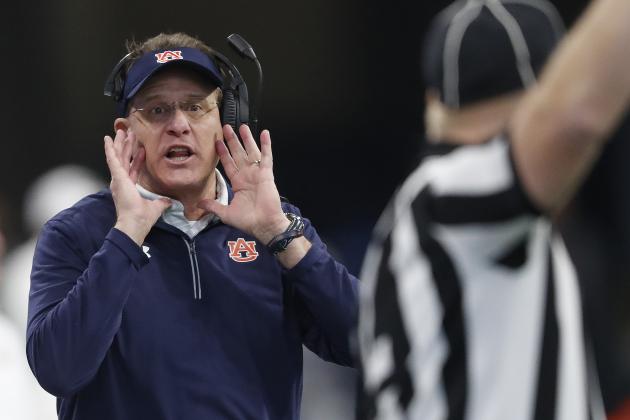 Auburn head coach Gus Malzahn speaks to an official during the first half of the Peach Bowl NCAA college football game between Central Florida and Auburn, Monday, Jan. 1, 2018, in Atlanta. (AP Photo/John Bazemore)