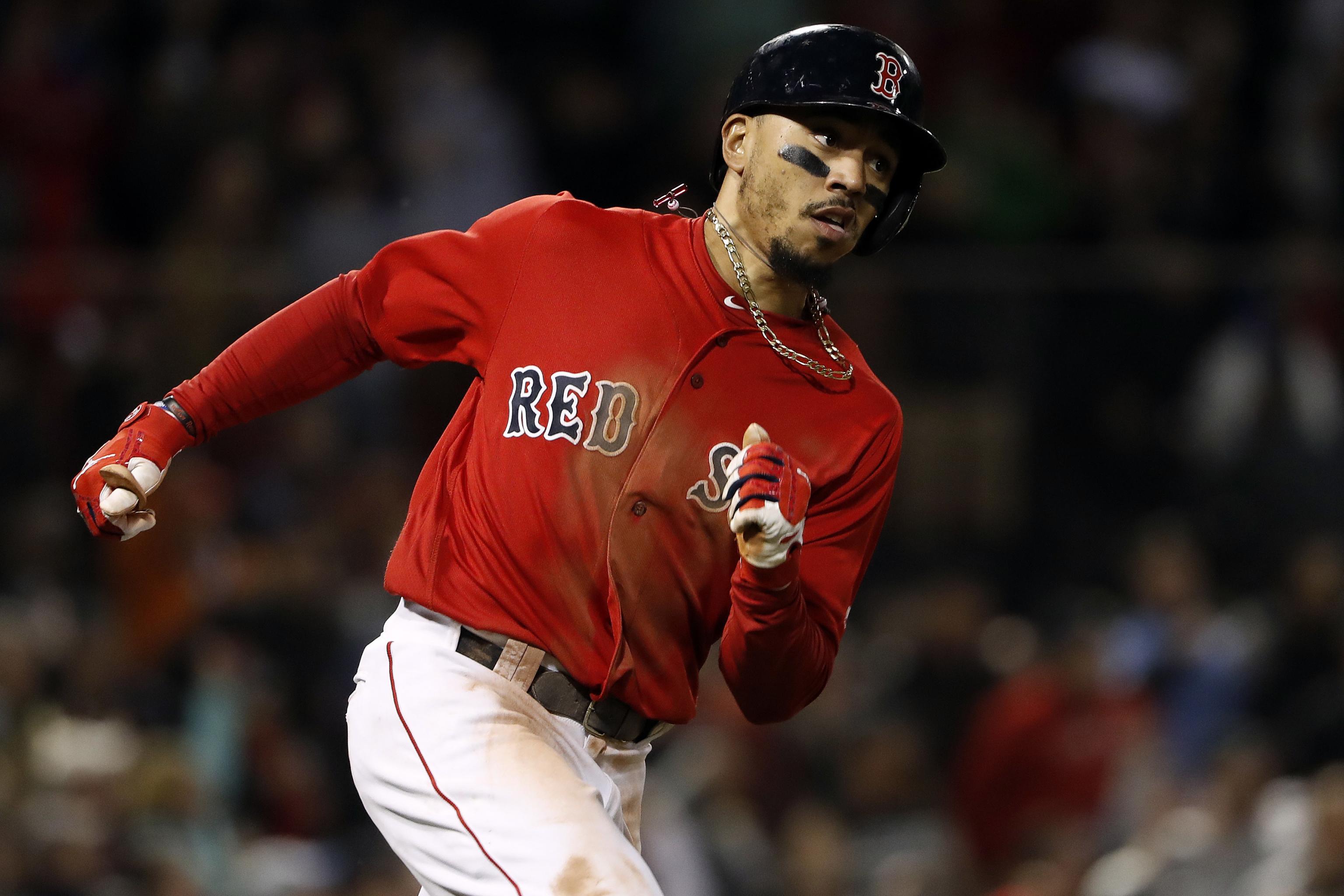 Mookie Betts out with foot injury, Red Sox think Toronto turf is responsible