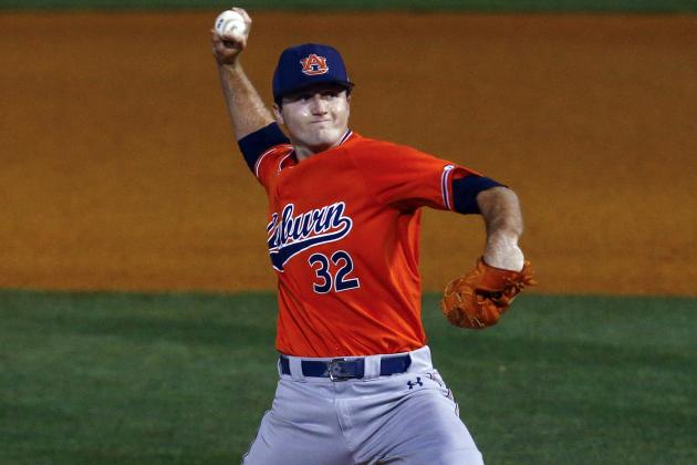 Auburn pitcher Casey Mize throws a pitch during the first inning of a Southeastern Conference tournament NCAA college baseball game against Texas A&M, Thursday, May 24, 2018, in Hoover, Ala. (AP Photo/Butch Dill)