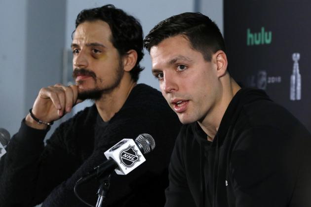Vegas Golden Knights forward David Perron, left, speaks to the media as defenseman Luca Sbisa, left, of Italy, listens, Sunday, June 3, 2018, at Kettler Capitals Iceplex in Arlington, Va. The Golden Knights will play the Washington Capitals in Game 4 of the NHL hockey Stanley Cup Final Monday night in Washington. (AP Photo/Bill Sikes)