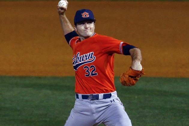 Auburn pitcher Casey Mize throws a pitch during the first inning of a Southeastern Conference tournament NCAA college baseball game against Texas A&M, Thursday, May 24, 2018, in Hoover, Ala. (AP Photo/Butch Dill)
