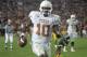 FILE - In this Jan. 4, 2006, file photo, Texas quarterback Vince Young rushes for the game-winning touchdown against Southern California during the Rose Bowl college football game in Pasadena, Calif. USC’s run at No. 1 ended in the 2006 Rose Bowl, which was also one of the best games of the decade. Texas _ led by coach Mack Brown and quarterback Vince Young _ topped the Trojans 41-38 in a back-and-forth thriller. (AP Photo/Paul Sakuma, File)