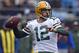 FILE - In this Dec. 17, 2017, file photo, Green Bay Packers' Aaron Rodgers looks to pass against the Carolina Panthers during the first half of an NFL football game in Charlotte, N.C. The Green Bay Packers opened on-field work in their offseason program this week, an especially important time for a team that has had a lot of changes since the end of a 7-9 season. On offense, Aaron Rodgers is healthy again after missing much of last season with a broken collarbone.. (AP Photo/Mike McCarn, File)