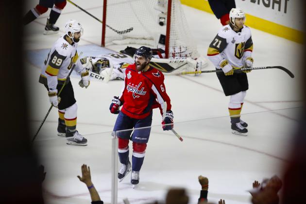 Washington Capitals defenseman Michal Kempny (6), of the Czech Republic, celebrates his goal against Vegas Golden Knights goaltender Marc-Andre Fleury (29) during the third period in Game 4 of the NHL hockey Stanley Cup Final, Monday, June 4, 2018, in Washington. Capitals won 6-2. Skating past Kempny are Vegas Golden Knights forwards Alex Tuch (89) and William Karlsson (71), of Sweden. (AP Photo/Pablo Martinez Monsivais)