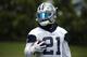 Dallas Cowboys running back Ezekiel Elliott (21) loss on during an organized team activity at its NFL football training facility in Frisco, Texas, Wednesday, May 23, 2018. (AP Photo/Ron Jenkins)
