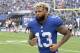 FILE - In this Oct. 8, 2017, file photo, New York Giants wide receiver Odell Beckham warms up prior to an NFL football game against the Los Angeles Chargers, in East Rutherford, N.J. The Giants have opened their first organized team activities under new coach Pat Shurmur with star receiver Odell Beckham Jr. in the building. Talking on a conference call Monday morning, April 9, 2018, Shurmur says he hasn't spoken with Beckham, whose name has been prominent in trade speculation in recent months. (AP Photo/Bill Kostroun, File)