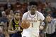 FILE - In this Jan. 14, 2017, file photo, Texas guard Andrew Jones (1) brings the ball up court during the second half of an NCAA college basketball game against West Virginia in Austin, Texas. The announcement that Jones was diagnosed with leukemia prompted concern and well wishes from across college basketball. He is now starting to offer glimpses of how he’s coping with his treatment, and sending “thank you” messages for the emotional and financial support that have poured in to help. (AP Photo/Eric Gay, File)