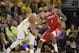 Golden State Warriors guard Stephen Curry, left, dribbles against Houston Rockets forward Trevor Ariza (1) during the first half of Game 3 of the NBA basketball Western Conference Finals in Oakland, Calif., Sunday, May 20, 2018. (AP Photo/Marcio Jose Sanchez)