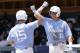 North Carolina's Cody Roberts (11) congratulates Michael Busch (15) following Busch's homer against Stetson during the inning of an NCAA super regional college baseball game in Chapel Hill, N.C., Friday, June 8, 2018. (AP Photo/Gerry Broome)