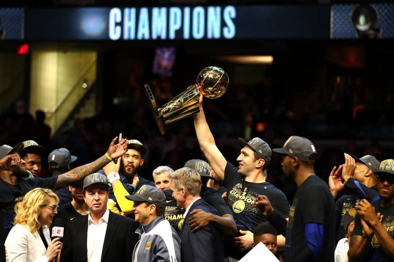 CLEVELAND, OH - JUNE 08: Zaza Pachulia #27 of the Golden State Warriors celebrates with the Larry O'Brien Trophy after defeating the Cleveland Cavaliers during Game Four of the 2018 NBA Finals at Quicken Loans Arena on June 8, 2018 in Cleveland, Ohio. The Warriors defeated the Cavaliers 108-85 to win the 2018 NBA Finals. NOTE TO USER: User expressly acknowledges and agrees that, by downloading and or using this photograph, User is consenting to the terms and conditions of the Getty Images License Agreement. (Photo by Gregory Shamus/Getty Images)