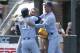 North Carolina pitcher Josh Hiatt (31) hugs catcher Brandon Martorano as infielder Dallas Tessar (7) celebrates following the team's win over Stetson following an NCAA super regional college baseball game in Chapel Hill, N.C., Saturday, June 9, 2018. North Carolina won 7-5 to advance to the College World Series. (AP Photo/Gerry Broome)