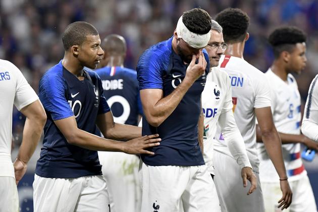 France's forward Olivier Giroud is comforted by team mate forward Kylian Mbappe as he leaves the pitch after suffering a head injury during the friendly football match between France and USA at the at the Parc Olympique lyonnais stadium in Decines-Charpieu, near Lyon on June 9, 2018. (Photo by JEFF PACHOUD / AFP)        (Photo credit should read JEFF PACHOUD/AFP/Getty Images)