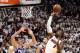 Miami Heat guard Dwyane Wade (3) shoots and scores in the fourth quarter as Philadelphia 76ers forward Ersan Ilyasova (23) defends during Game 4 of a first-round NBA basketball playoff series Saturday, April 21, 2018, in Miami. The 76ers won 106-102. (AP Photo/Joe Skipper)