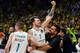 TOPSHOT - Real Madrid's Slovenian Luka Doncic (R) celebrates with team mate Real Madrid's French forward Fabien Causeur their team's 85-80 win in the Euroleague Final Four finals basketball match between Real Madrid and Fenerbahce Dogus Istanbul at The Stark Arena in Belgrade on May 20, 2018. (Photo by Andrej ISAKOVIC / AFP) (Photo credit should read ANDREJ ISAKOVIC/AFP/Getty Images)
