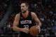 Houston Rockets forward Ryan Anderson controls the ball during the second half of an NBA basketball game against the Detroit Pistons, Saturday, Jan. 6, 2018, in Detroit. (AP Photo/Carlos Osorio)