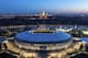 This photo taken on Monday, April 23, 2018, shows an aerial view of the World Cup Luzhniki stadium with the Moscow River and the State University in the background in Moscow, Russia. The Luzhniki stadium will hold the 2018 World Cup final. (AP Photo/Dmitry Serebryakov)