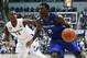 Creighton's Khyri Thomas (2) drives against Xavier's Malcolm Bernard (11) in the second half of an NCAA college basketball game, Monday, Jan. 16, 2017, in Cincinnati. Creighton won 72-67. (AP Photo/John Minchillo)